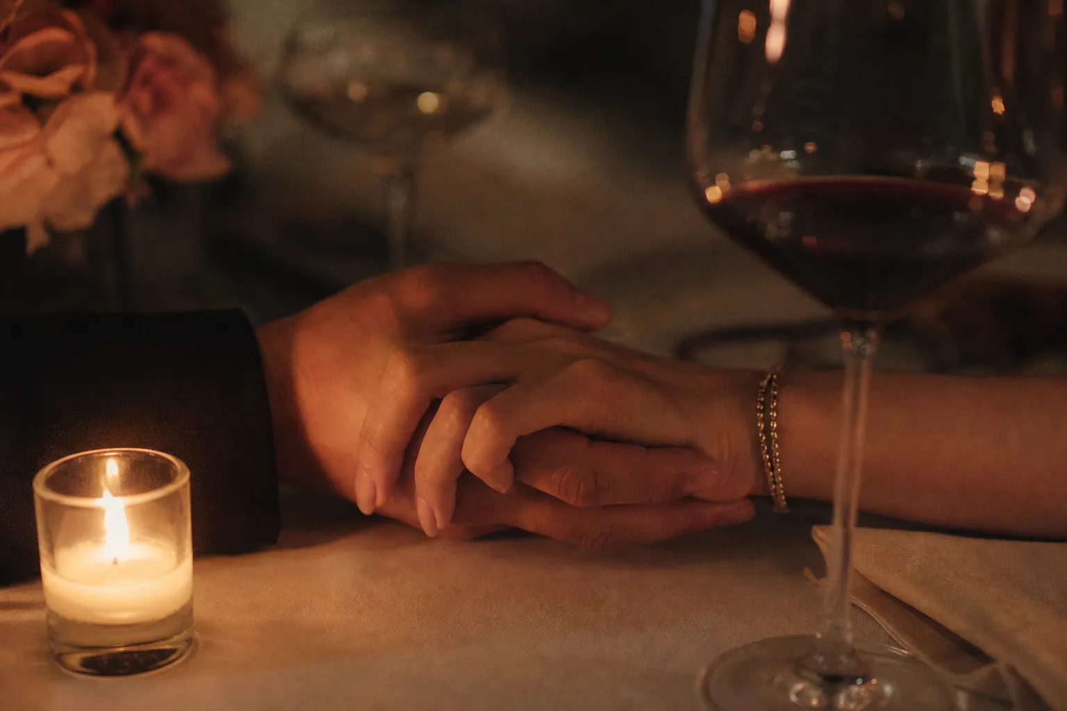 A couple sharing a warm, thoughtful conversation over coffee, reflecting on their connection.
